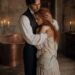 Aiden holding Tess protectively in his arms beside a copper bathtub in their private room