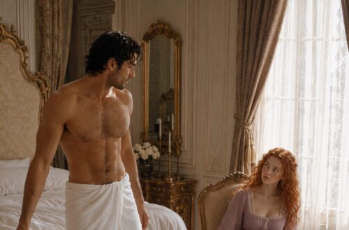 Shirtless Aiden wearing a towel while Tess sits nearby in a pink dress reading a book