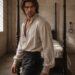 Kaelan in an open white shirt inside Nirella’s chamber, Alexandra Veľká